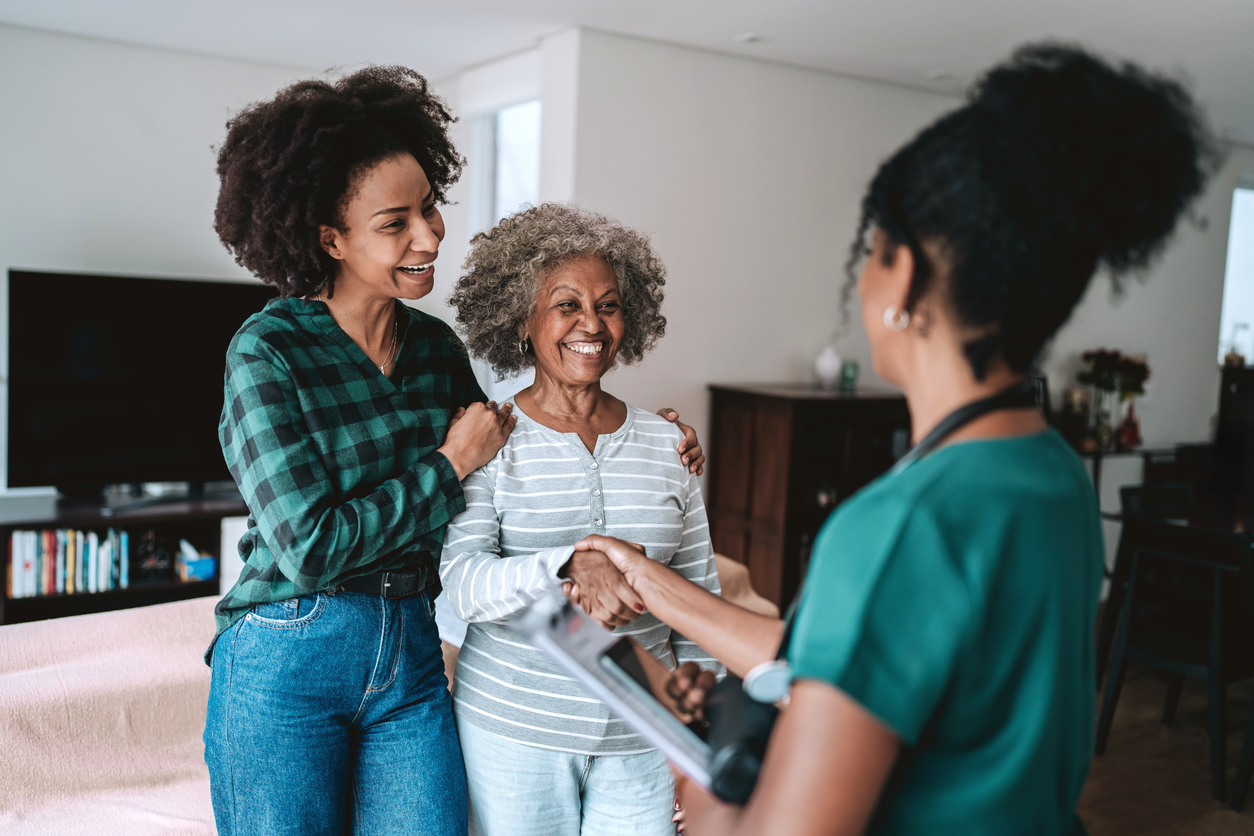 A home care professional greeting a client